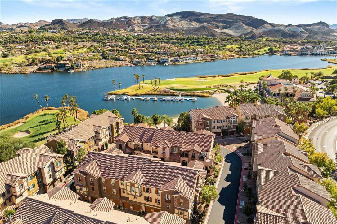 Image 3: Lake living meets mountain views in this vibrant w
