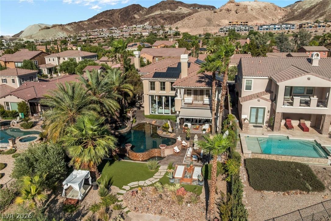 Image 2: An aerial perspective reveals a luxurious backyard