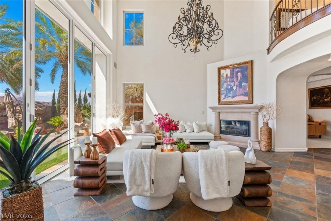 Image 3: Natural light floods this living area through expa