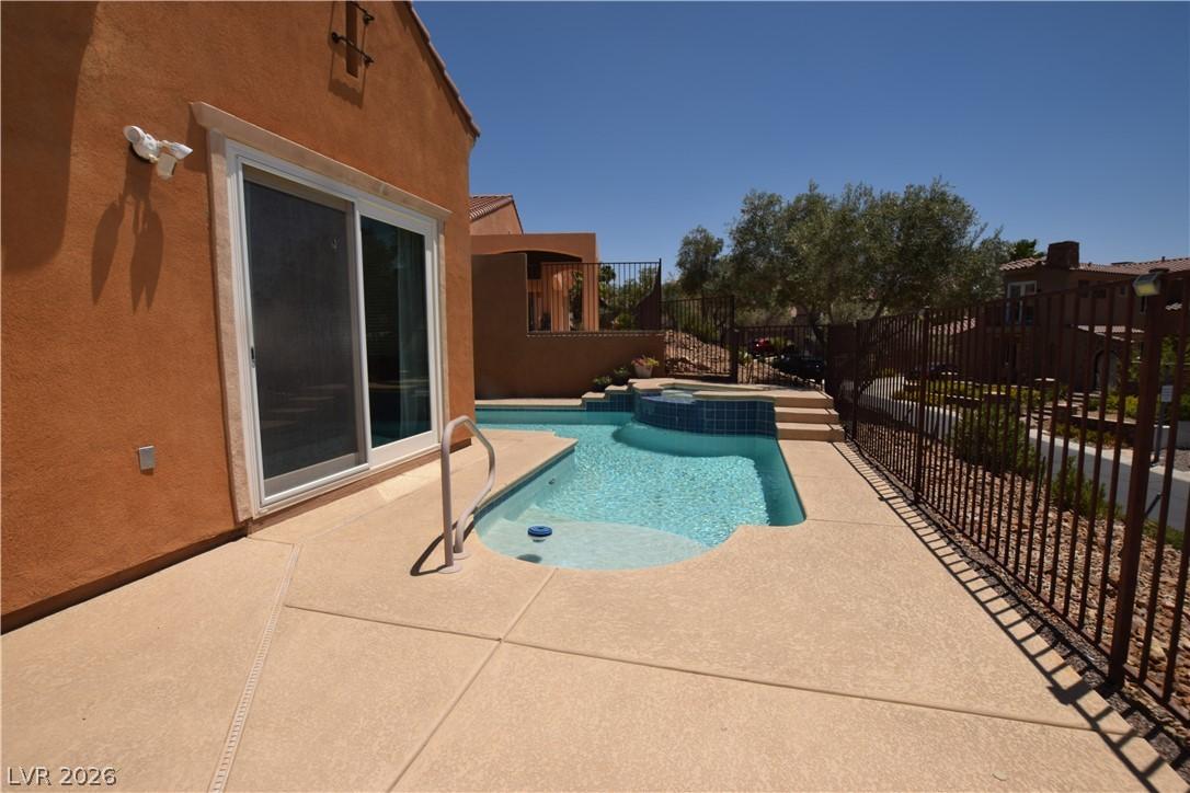 Image 2: An inviting private pool and spa await with ample