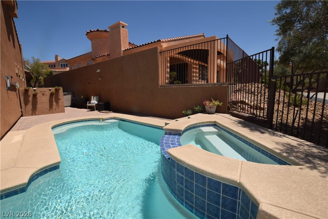 Image 3: A tranquil courtyard features a sparkling pool and