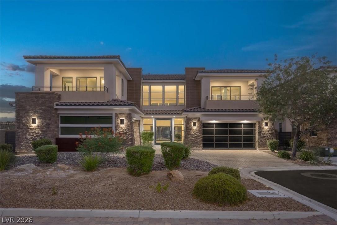 Image 1: A contemporary exterior showcasing balconies and a