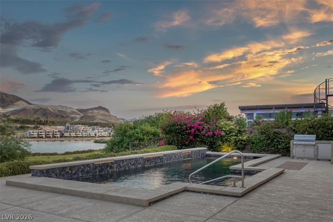 Image 2: An inviting private pool and spa await, complement