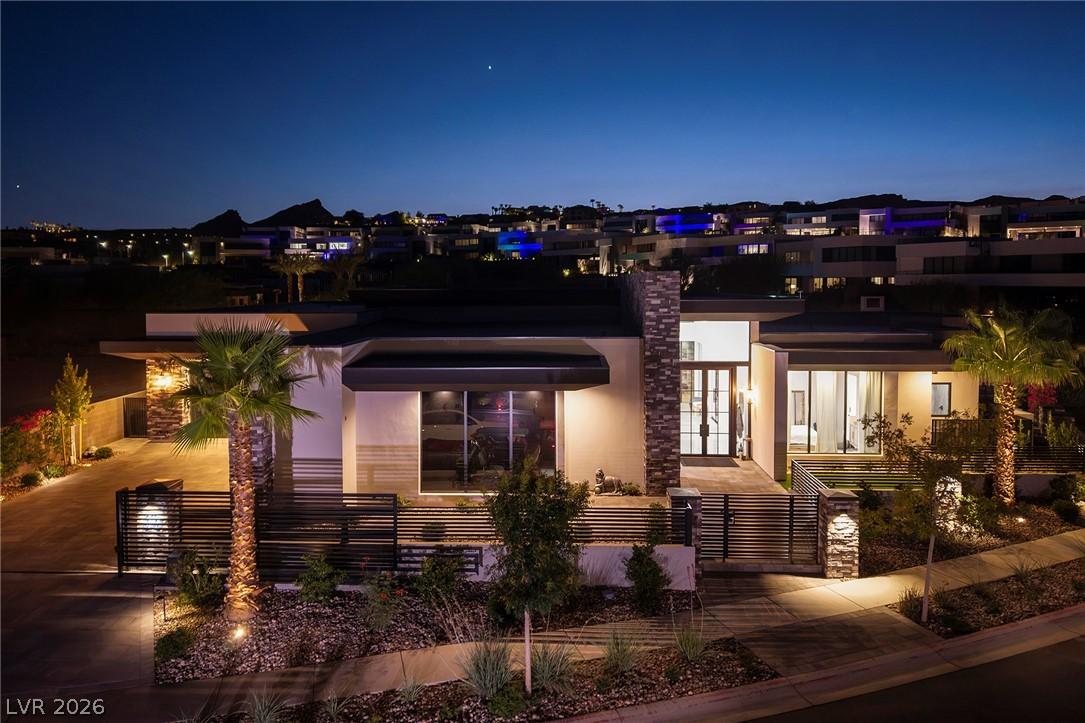 Image 1: An illuminated modern dwelling showcases its strik