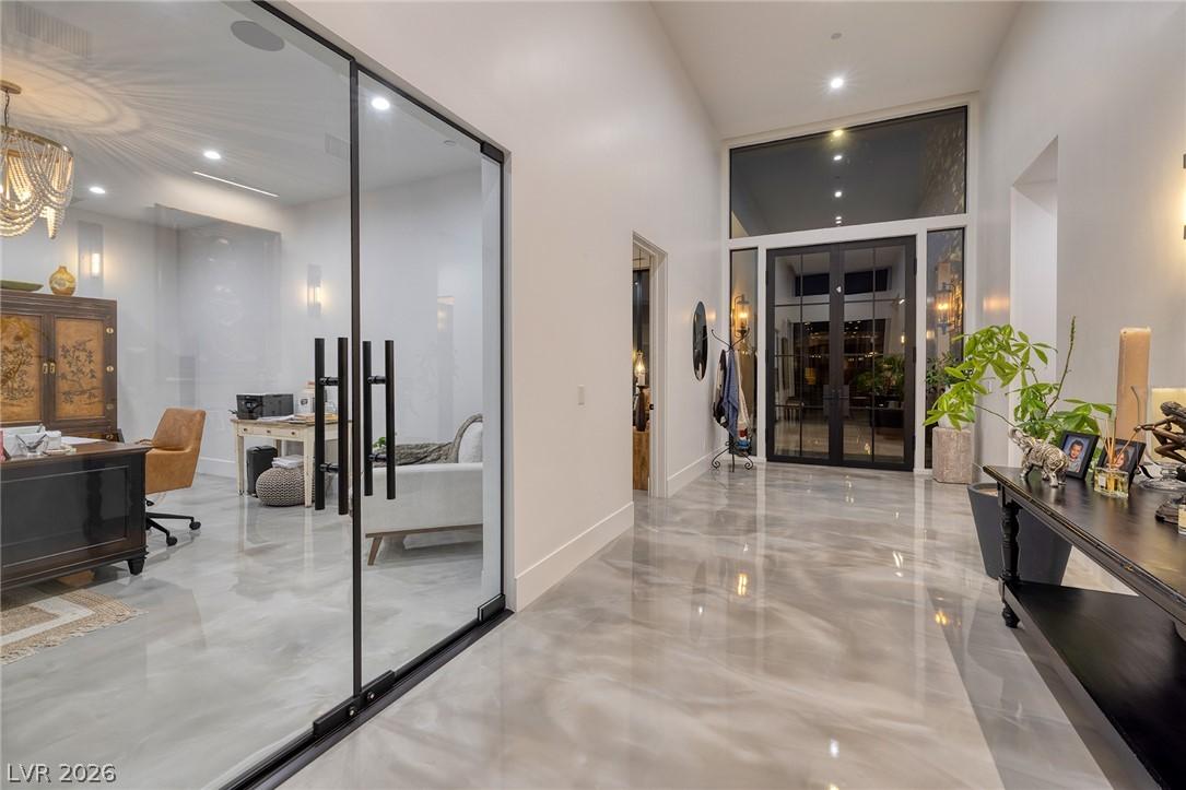 Image 4: An inviting foyer showcases high ceilings and glos