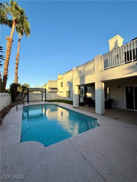 Image 2: View of pool with a patio