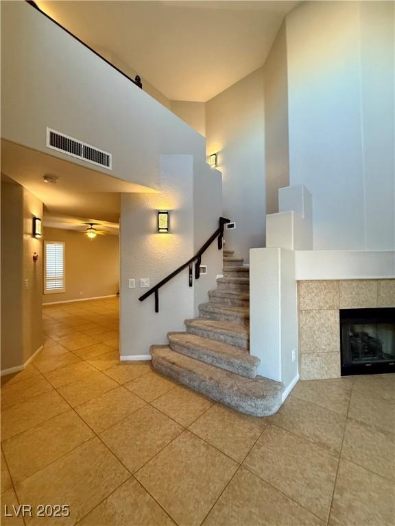Image 3: Stairs with a high ceiling, tile patterned floors,