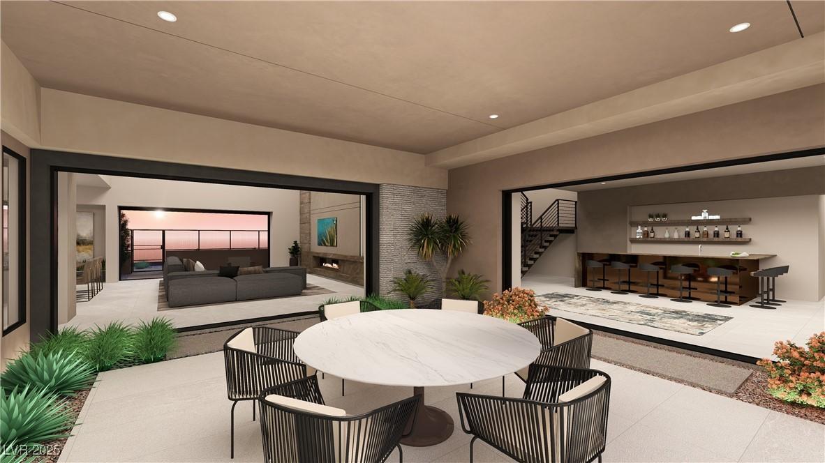 Image 3: Dining room featuring recessed lighting, stairway,