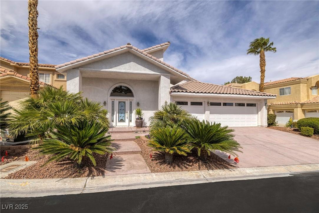 Image 2: Mediterranean / spanish-style house with driveway,