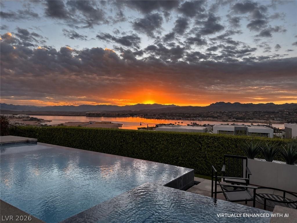 Image 1: This outdoor oasis offers breathtaking sunset view
