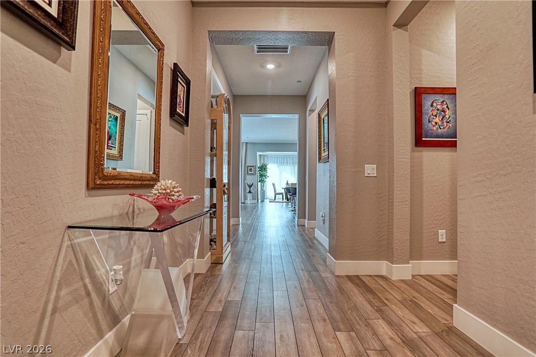 Image 3: A well-lit corridor with recessed lighting guides