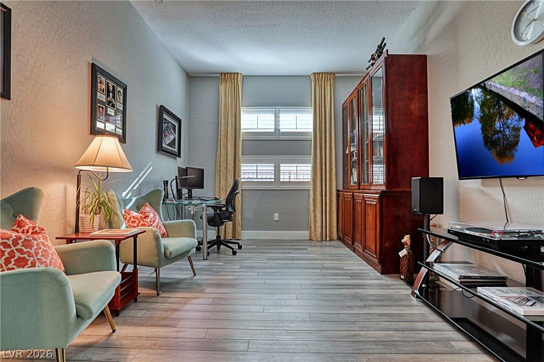 Image 4: A versatile space features durable plank flooring,