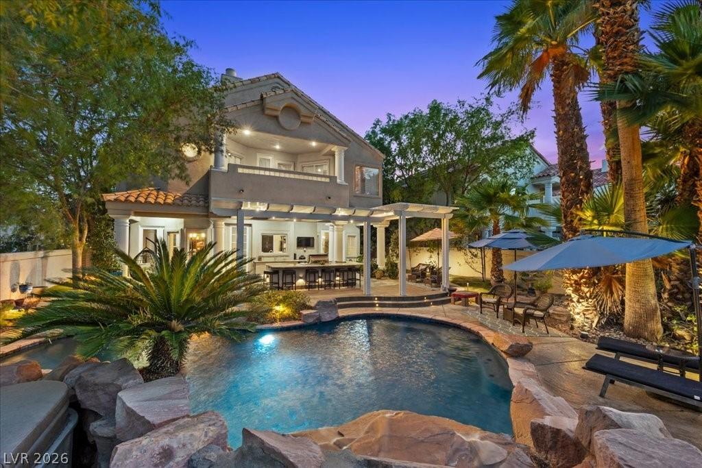 Image 4: An inviting outdoor oasis with a sparkling pool an