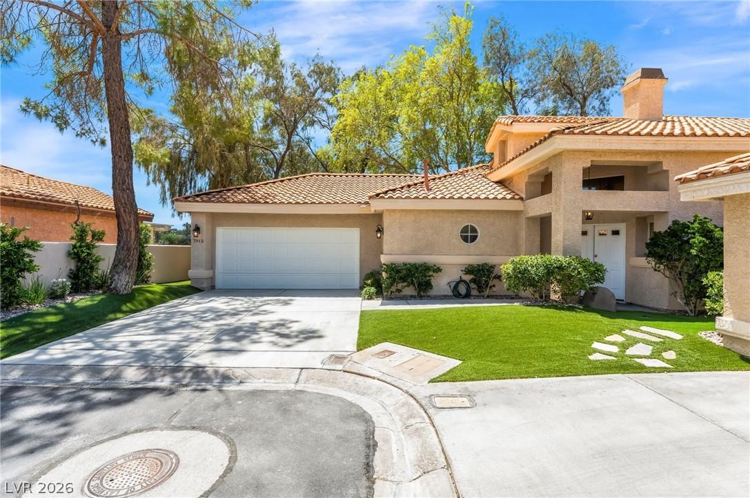 Image 2: This appealing stucco home features an attached ga