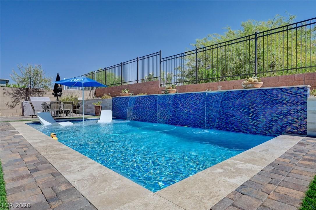 Image 1: Enjoy outdoor living with a private pool featuring