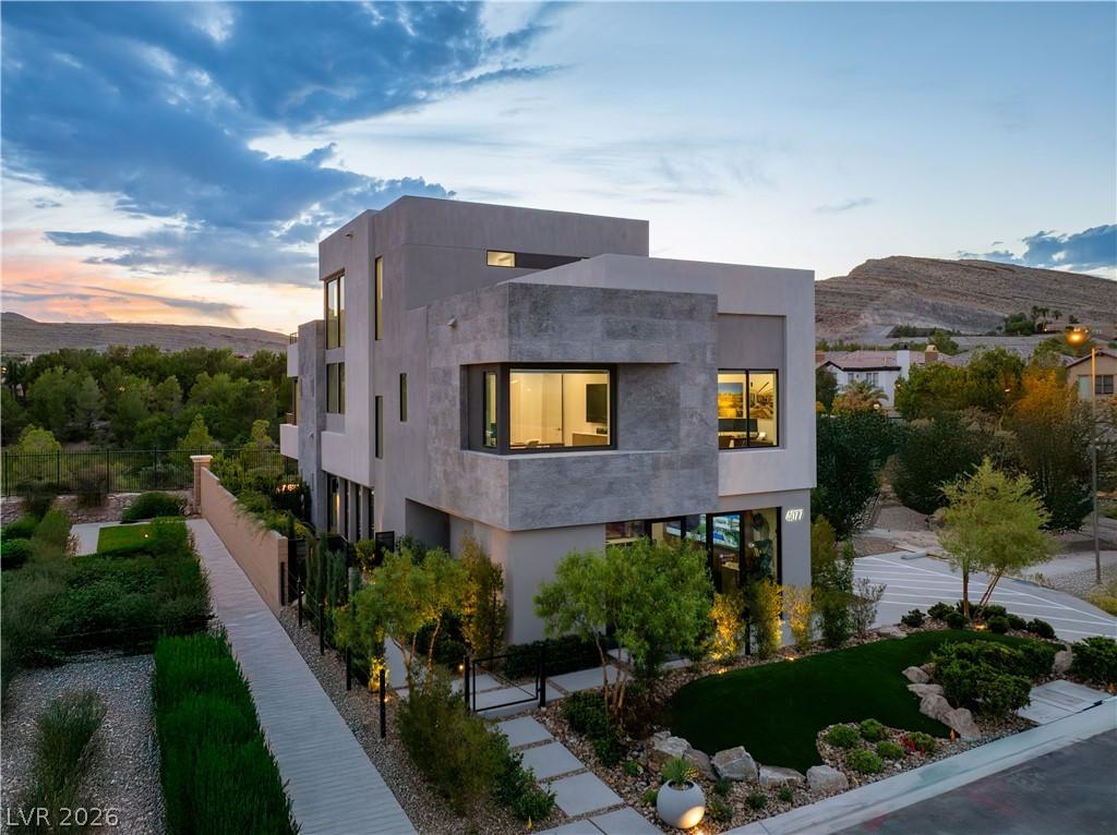 Image 2: A modern architectural marvel stands against a ser