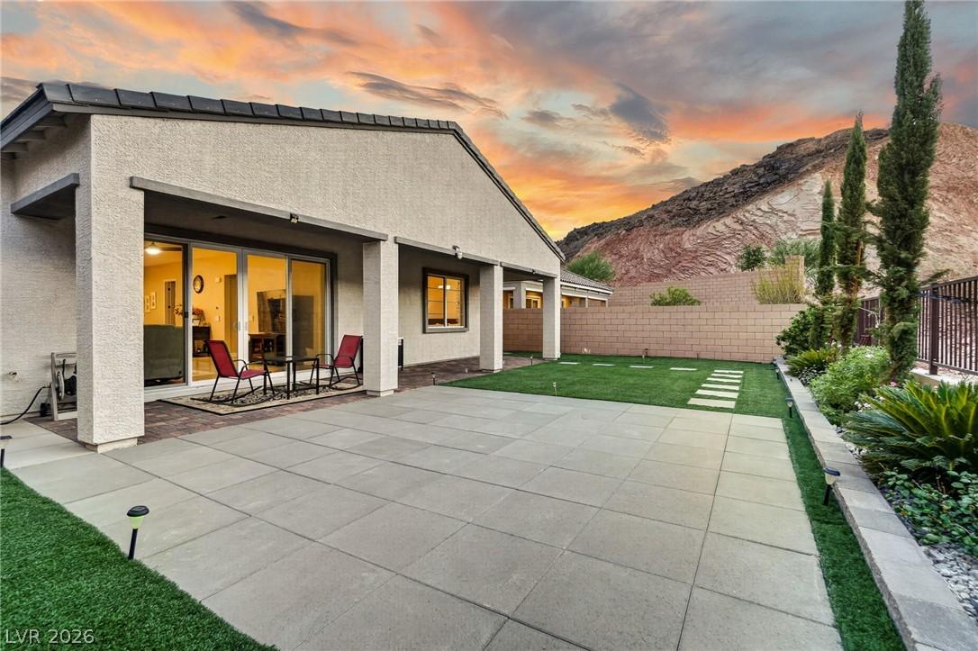 Image 4: A desert oasis with a spacious patio, manicured la