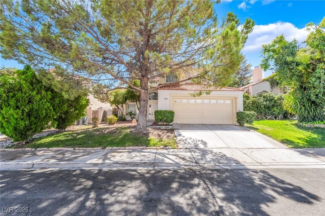 Image 2: View of front of property with driveway, a tile ro