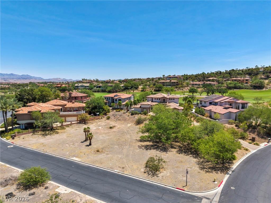 Image 4: An aerial perspective reveals a prime corner lot n