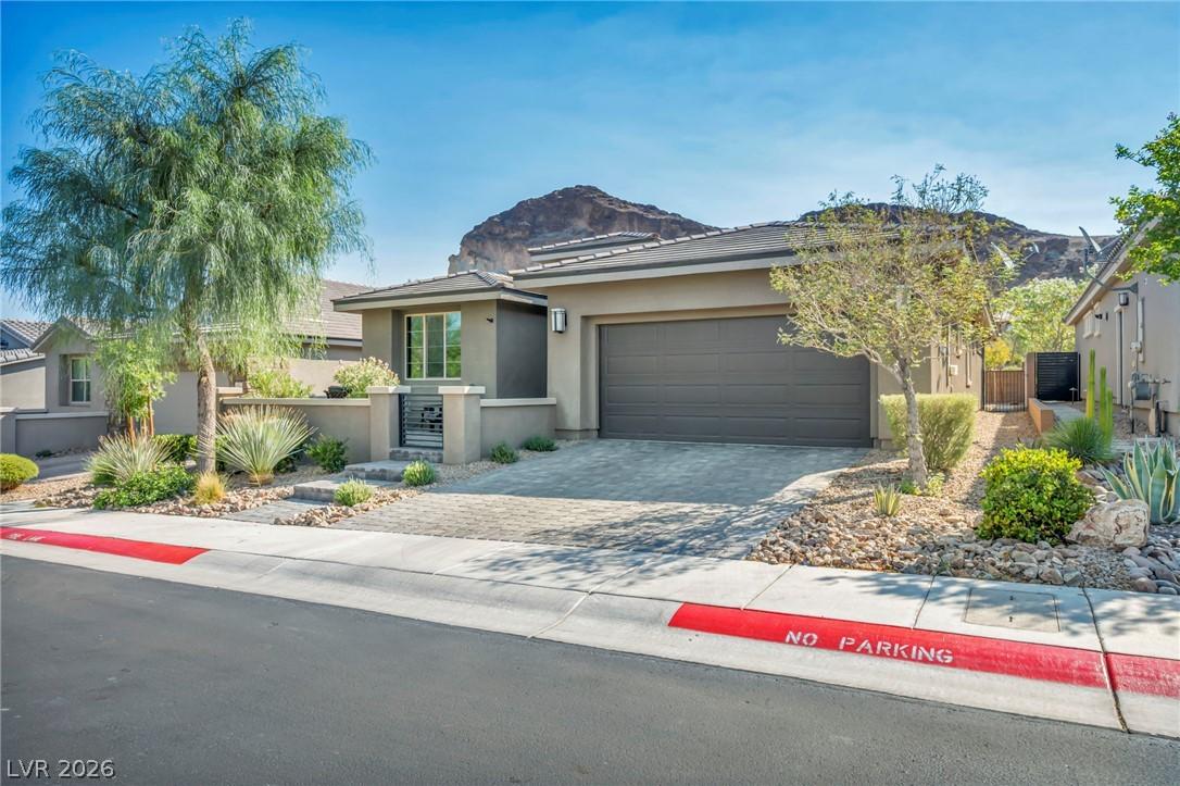 Image 3: A desert oasis home with a modern facade and mount