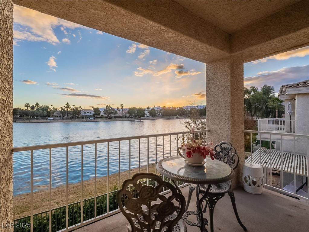 Image 2: Balcony at dusk with a water view