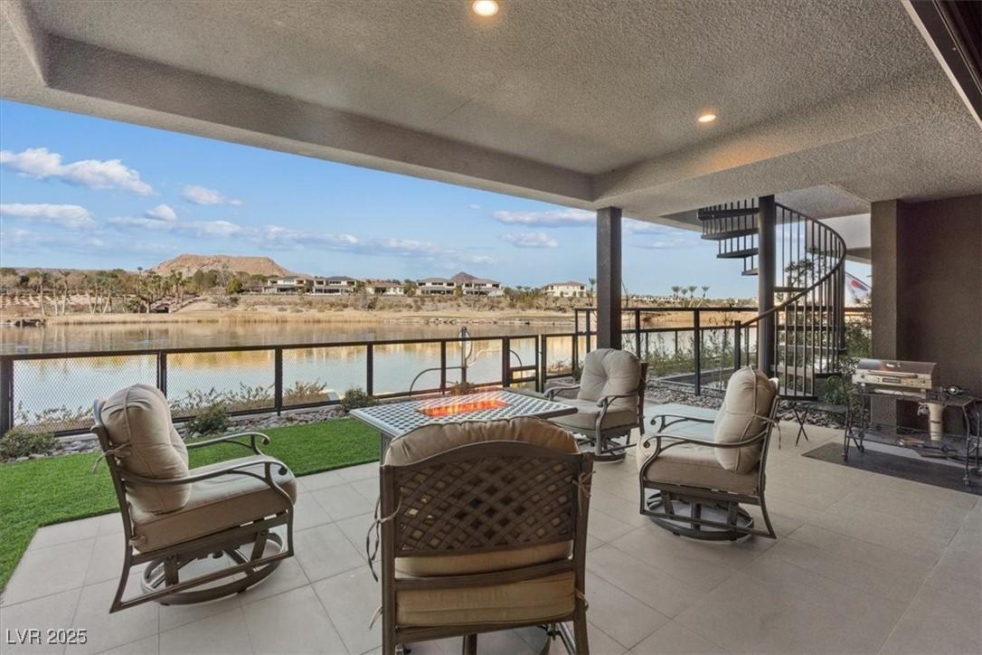 Image 4: Back Yard, extended patio overlooking the Lake