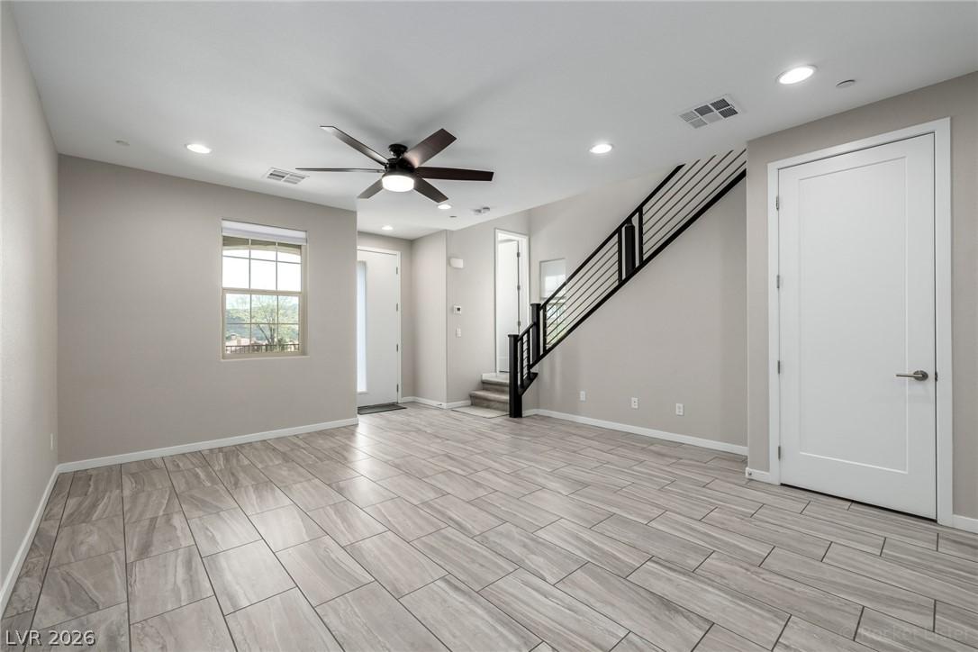 Image 4: A spacious living area features ceramic tile floor