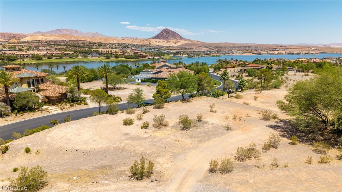 Image 1: A spacious desert lot offers unobstructed lake and