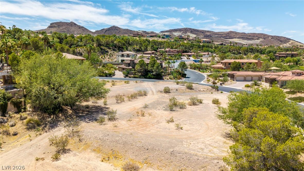 Image 3: A spacious, buildable desert lot offering vast mou