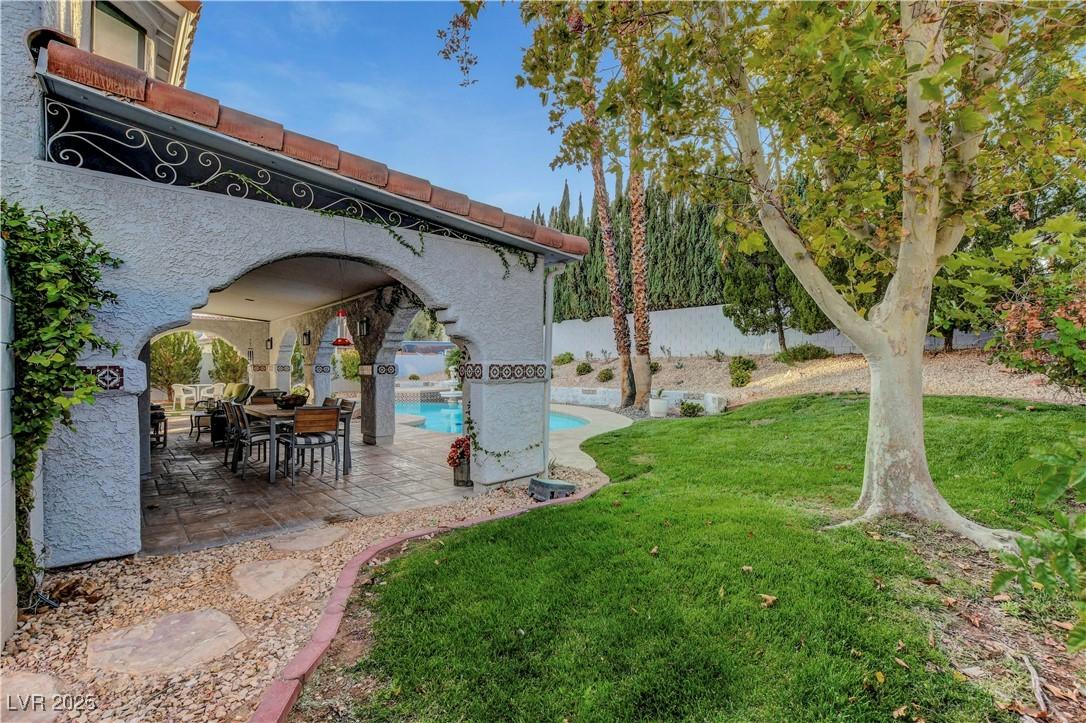 Image 1: View of yard with a patio area