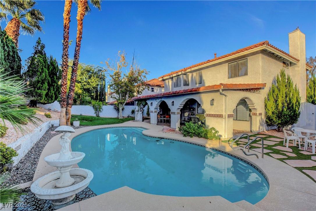 Image 4: View of pool with a patio