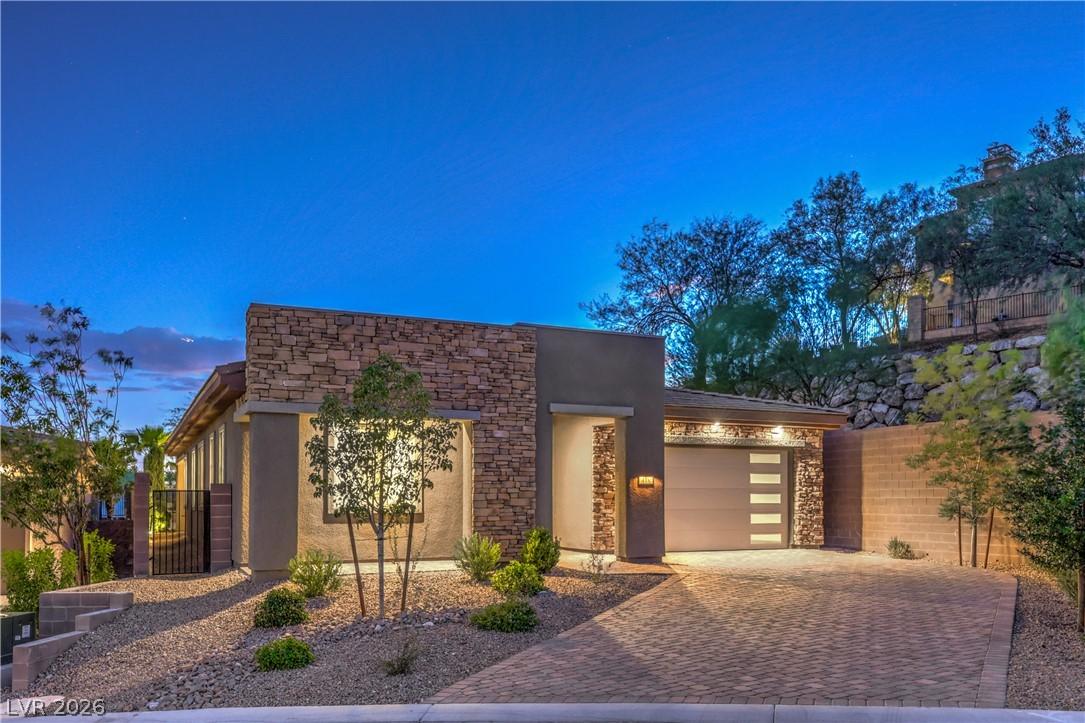 Image 2: A modern facade with stacked stone accents and a p