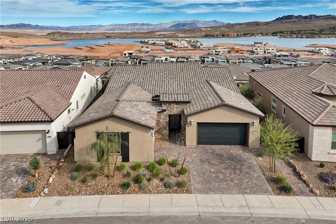 Image 2: A well-manicured desert landscape frames this sing