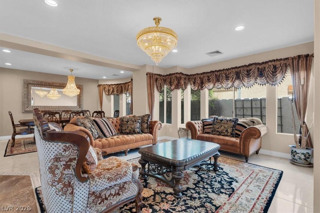 Image 2: Elegant chandeliers illuminate this refined living