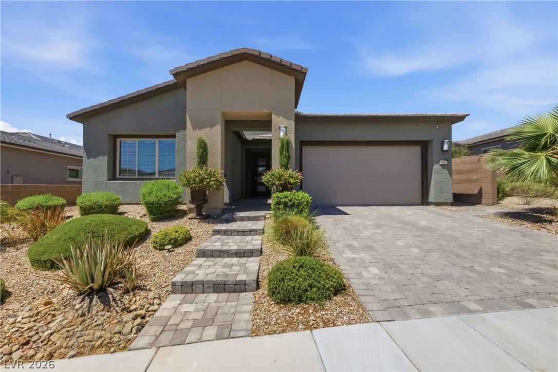Image 2: A desert-friendly landscape surrounds this contemp