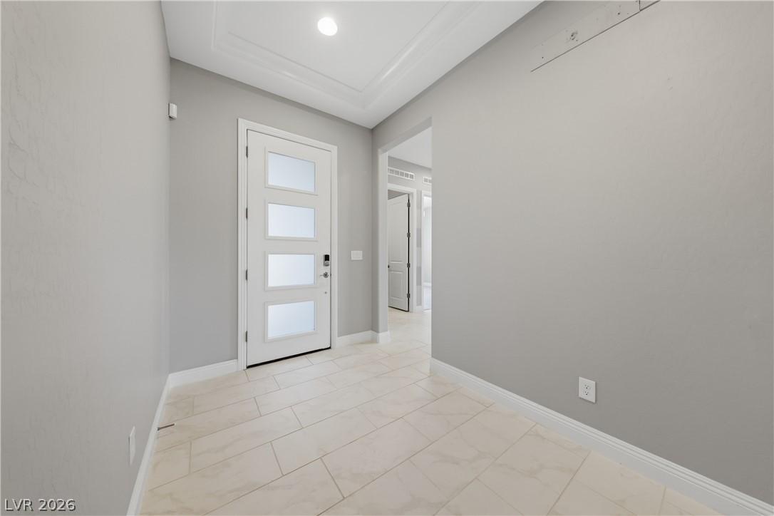 Image 3: A graceful entry with elegant crown molding leads