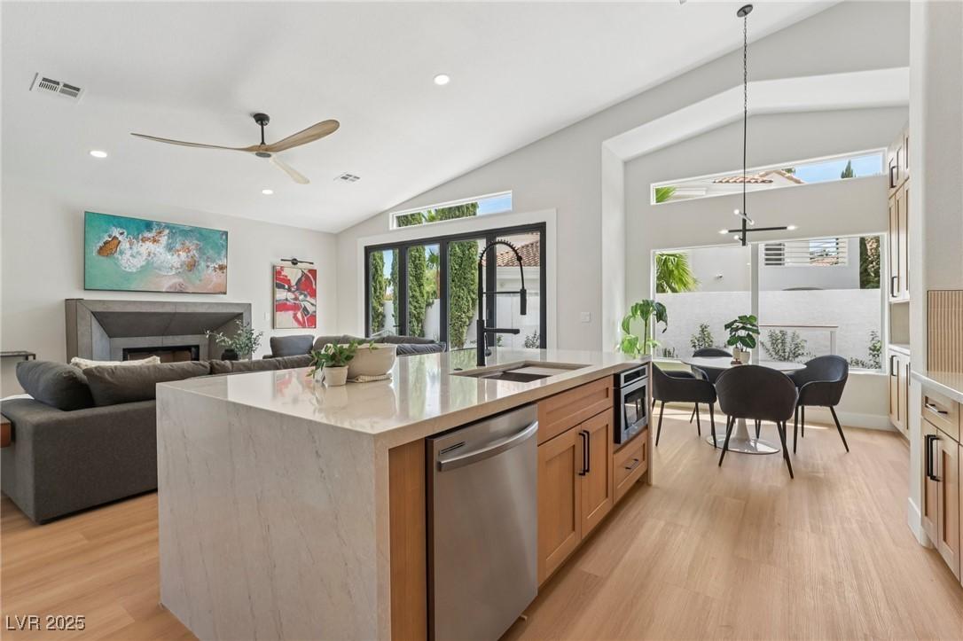 Image 2: Kitchen featuring vaulted ceiling, open floor plan