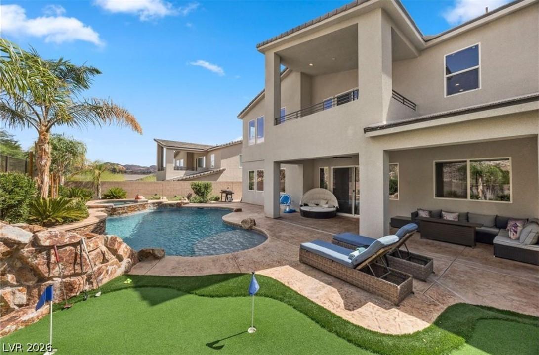 Image 4: Resort style backyard with pool, spa, covered pati
