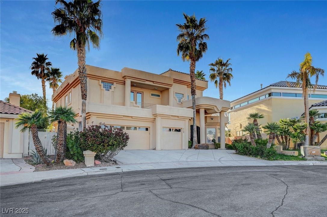 Image 3: View of front of home with fence, concrete drivewa