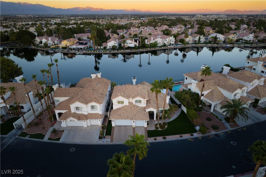 Image 2: Aerial perspective of suburban area featuring a wa