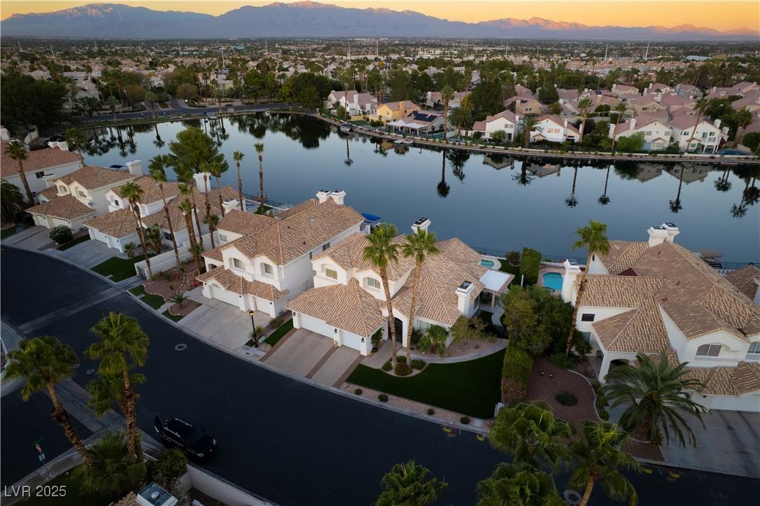 Image 3: Aerial view at dusk of a water and mountain view a