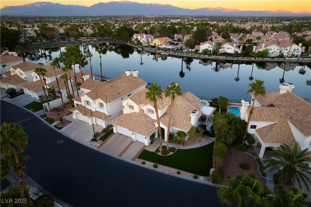 Image 4: Aerial perspective of suburban area featuring a wa