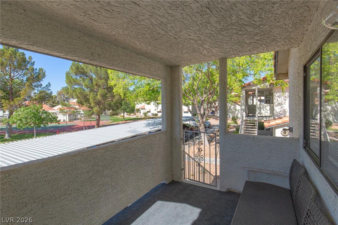 Image 4: An inviting private patio offers verdant views of