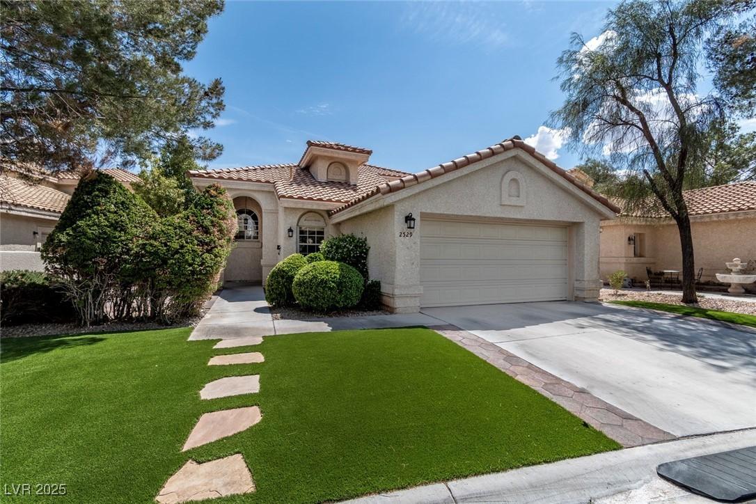 Image 4: Mediterranean / spanish-style home featuring an at
