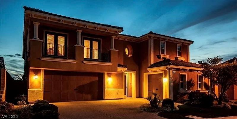 Image 4: Illuminated exterior showcasing a stylish garage,