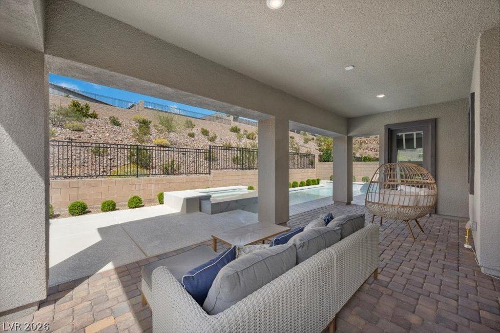 Image 3: Relax in this comfortable covered patio, complete