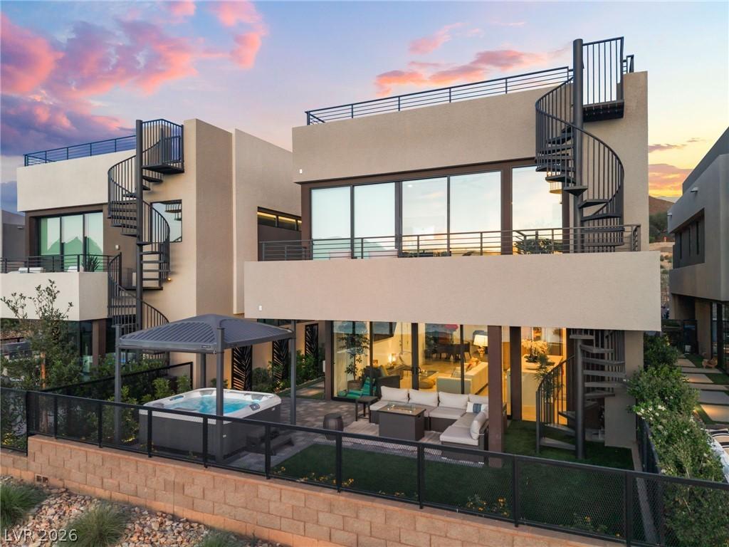 Image 2: Modern desert oasis featuring a hot tub under a pe
