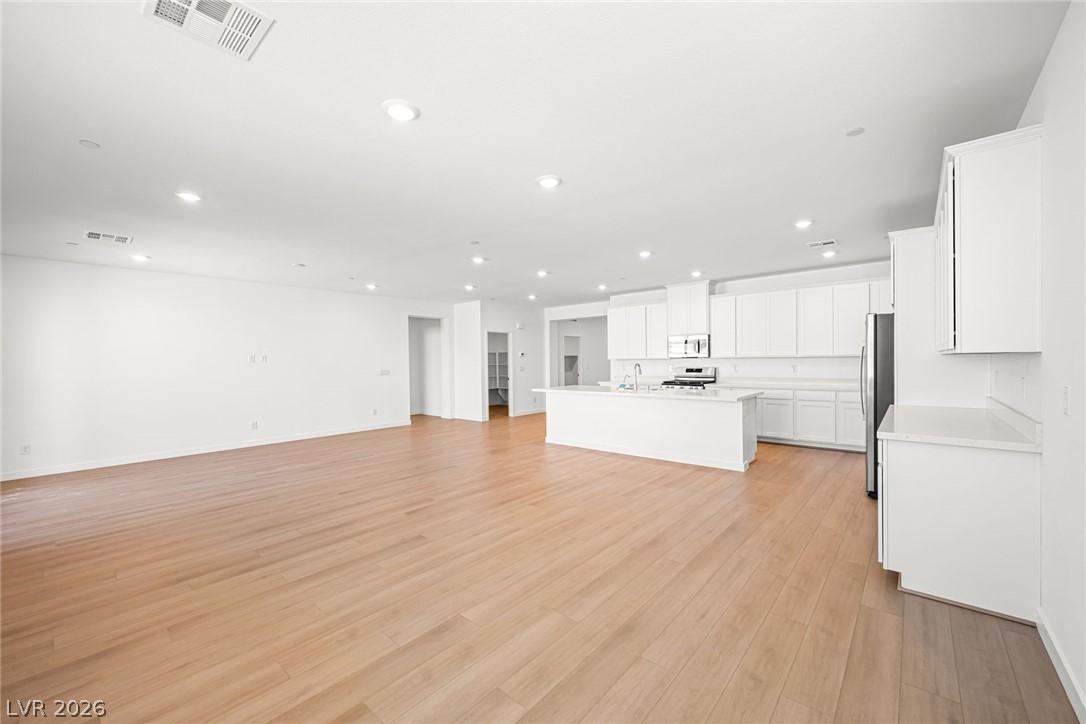 Image 4: An open concept living area transitions seamlessly