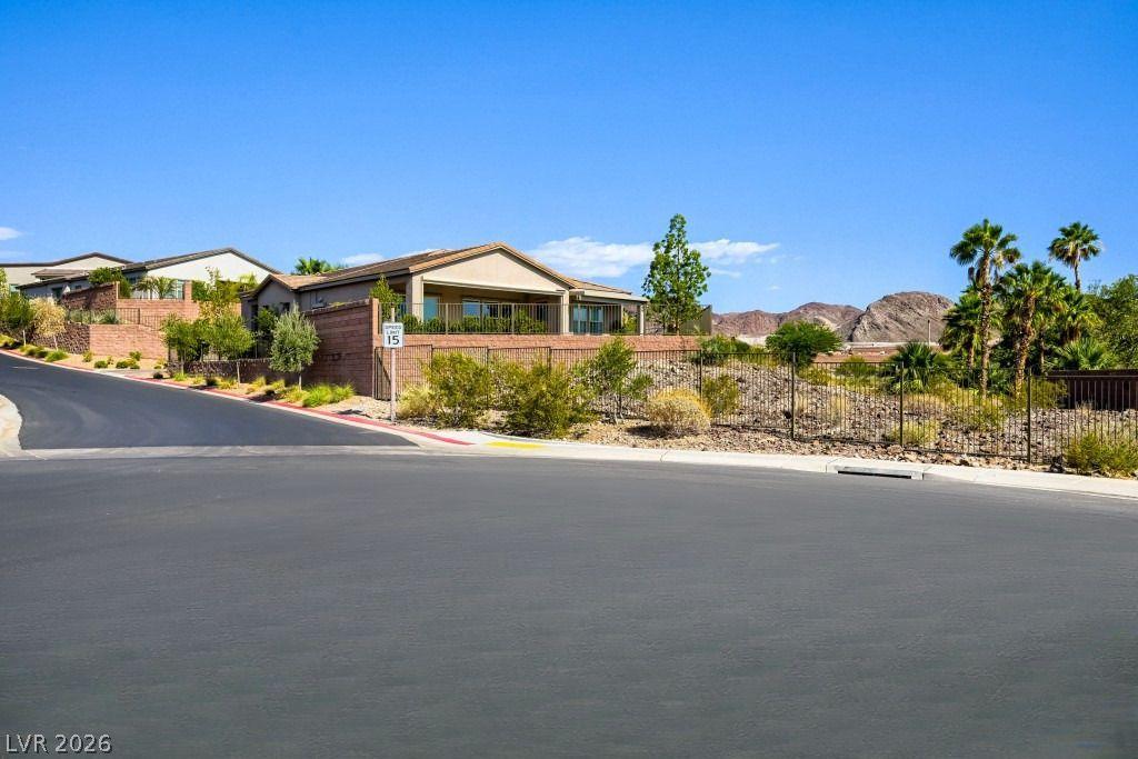 Image 3: A desert oasis home, nestled on a hillside with mo