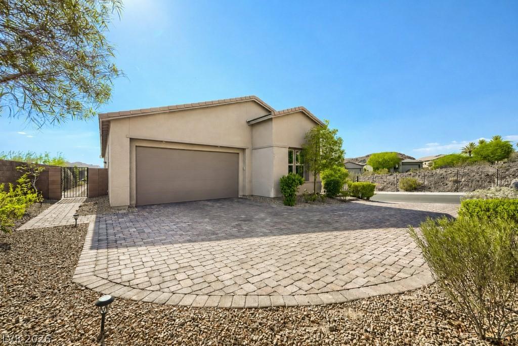 Image 4: A welcoming paver driveway leads to this charming